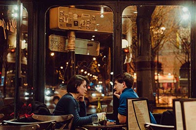 Man and woman on a date in a cafe